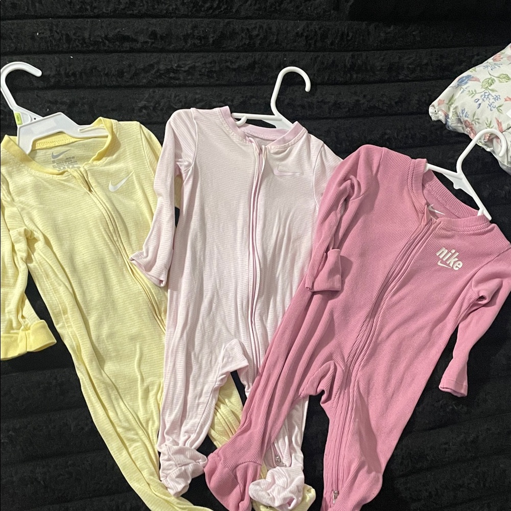 Nike Kids One Piece Footies - Pink, Yellow, and Light Pink
